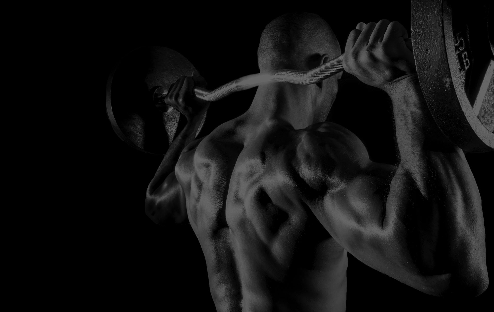 Man Lifting Barbell Behind Head 1